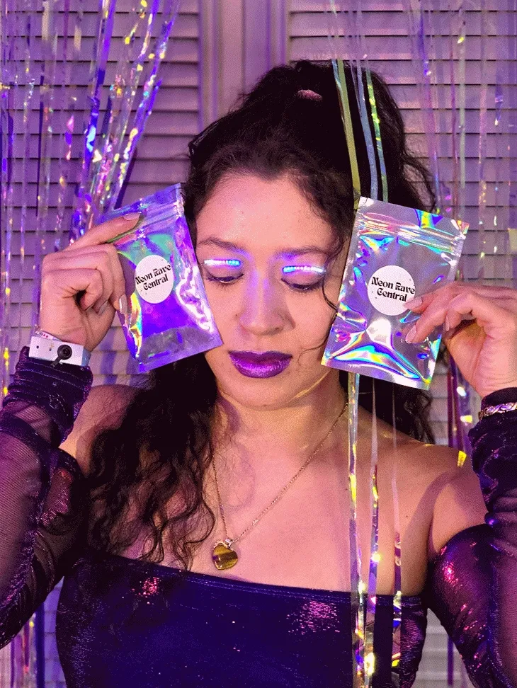 LED light eyelashes worn under neon light